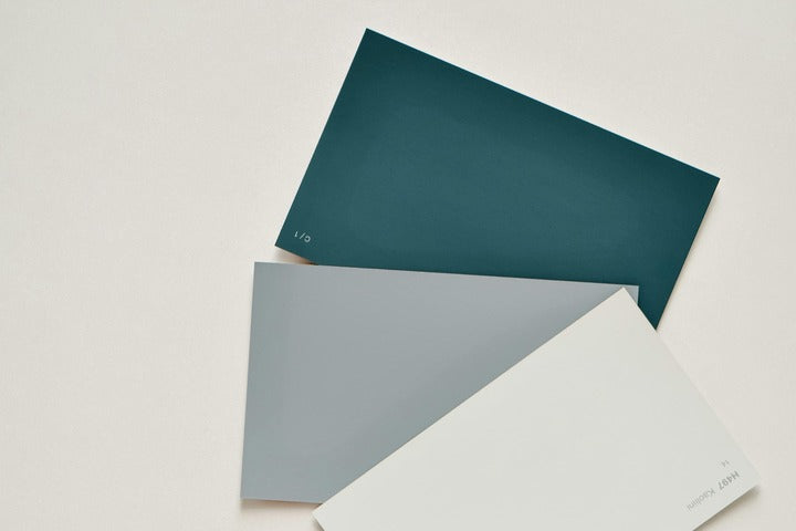Three color swatches in teal, gray, and white on a light background.